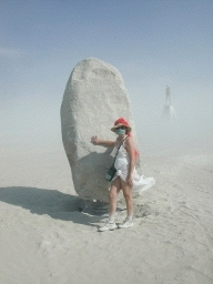 A dusty pilgrim at a dusty obelisk, with the dusty Man.