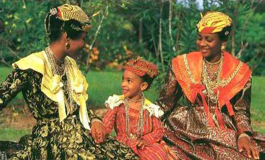 Three women in fanciful costumes.